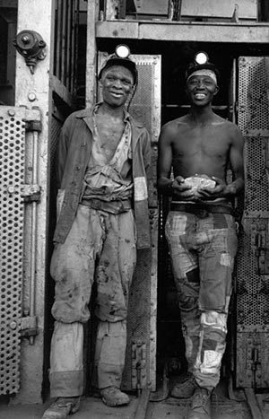 Two miners at the end of their shift, Kimberley, 1947-48.