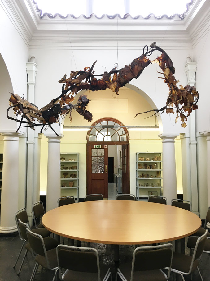 Photograph of the sculpture Ouroboros in the UCT Pathology Learning Centre