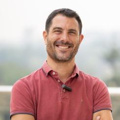 A head-and-shoulders photo of Prof. Paolo Denti. He is wearing a red polo shirt.