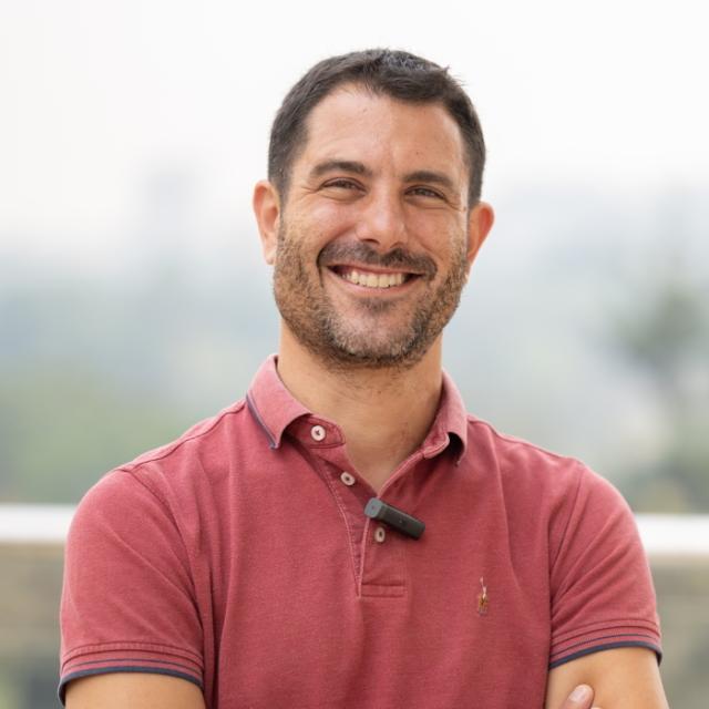 A head-and-shoulders photo of Prof. Paolo Denti. He is wearing a red polo shirt.