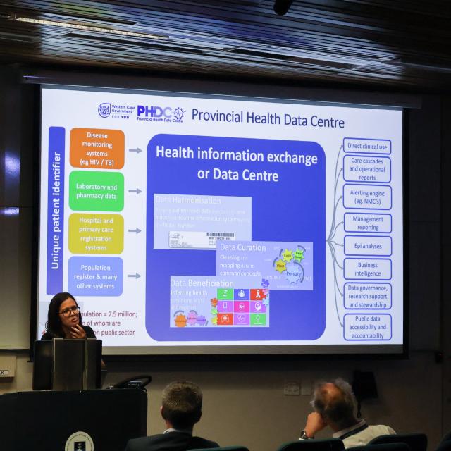 Hannah Hussey explaining C-SHARP to an audience