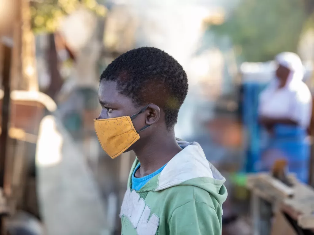 Portrait of a African boy with mask